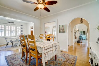 Formal dining area with ceiling fan and space for hutch and a really long table for holiday gatherings....with views into the living room and family room.
