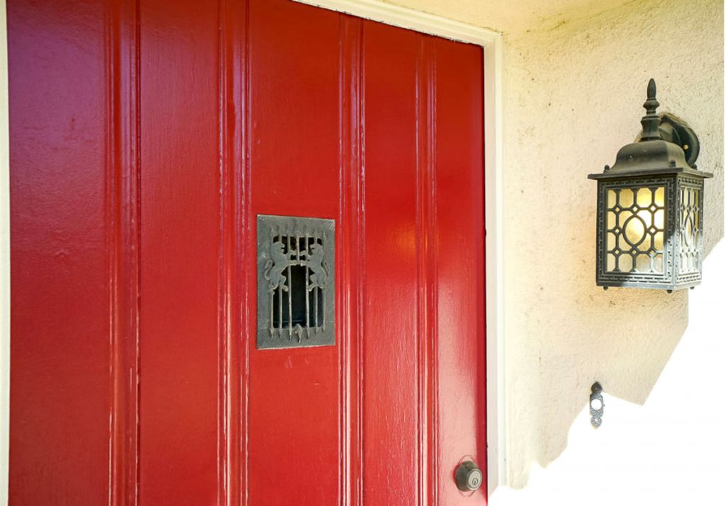 Exterior view of vintage speakeasy peephole that opens from the inside ...