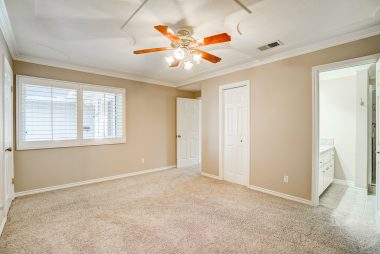 Master bedroom suite with two walk-in closets and a private remodeled 3/4 bathroom.