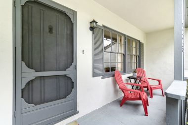 Breezy front porch with Adirondack chairs included.