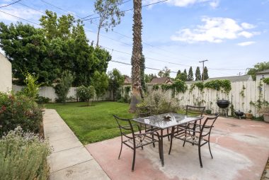 Beautifully landscaped backyard with fruit trees, auto sprinkler system, and a shed behind the garage. Room for gardening and entertaining.