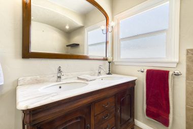 Hall bathroom with double vanity.