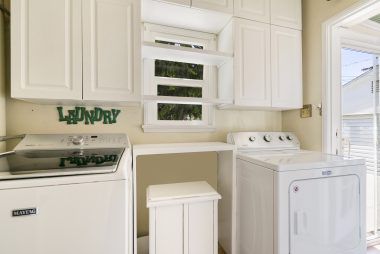Separate indoor laundry room (appliances included).