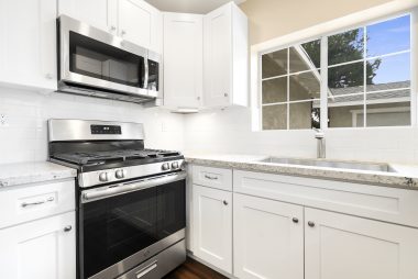BRAND NEW gas stove and built-in microwave, as well as brand new dishwasher too.