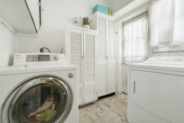 Indoor laundry with gas hookup for clothes dryer.