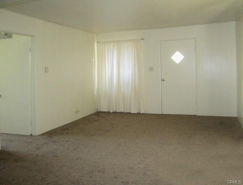 Unit #1 -- front entrance into Living room