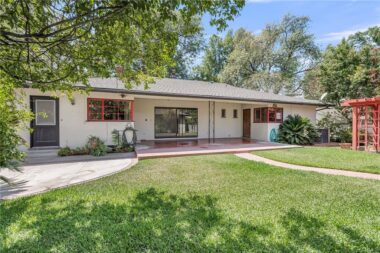 Lovely backyard with huge covered patio for year-round relaxation and entertaining.