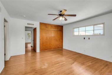 Alternate view of the primary bedroom of the closet and door to the hallway.