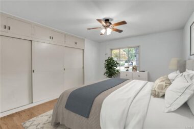 Virtually staged bedroom #3 with original hardwood flooring.