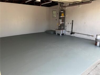 Painted floor, newer water heater, finished walls, LED lights, auto garage door opener, and laundry hookups.