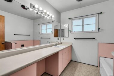 Hallway bathroom with room for additional sink if needed.