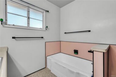 Hallway bathroom with soaking tub (easy to add a hand-held shower wand and curtain).