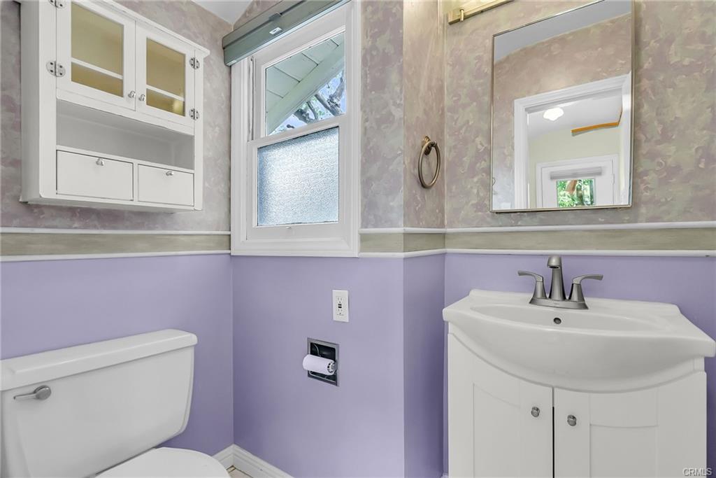 3/4 bathroom adjacent to the pantry with updated vanity and vintage shower.