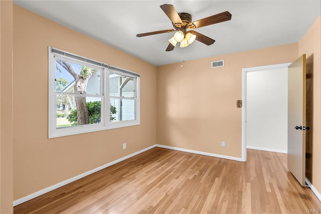 Bedroom #1 overlooks the front of the house and has easy access to the 3/4 bathroom. Original hardwood flooring.