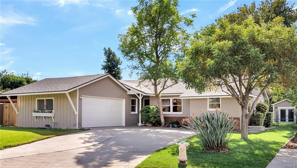 Double-wide driveway for 4 cars, in addition to the 2-car garage parking -- SIX parking spots total, plus potential RV parking! The auto roll-up door has been fitted with a new rubber lip, and there is a 2-yr-old 50-gallon gas water heater, as well as 4-yr-old washer/dryer units which are included (and which could also be relocated to the pantry area off the kitchen if required. There is a new faucet on the utility sink in the garage too.
