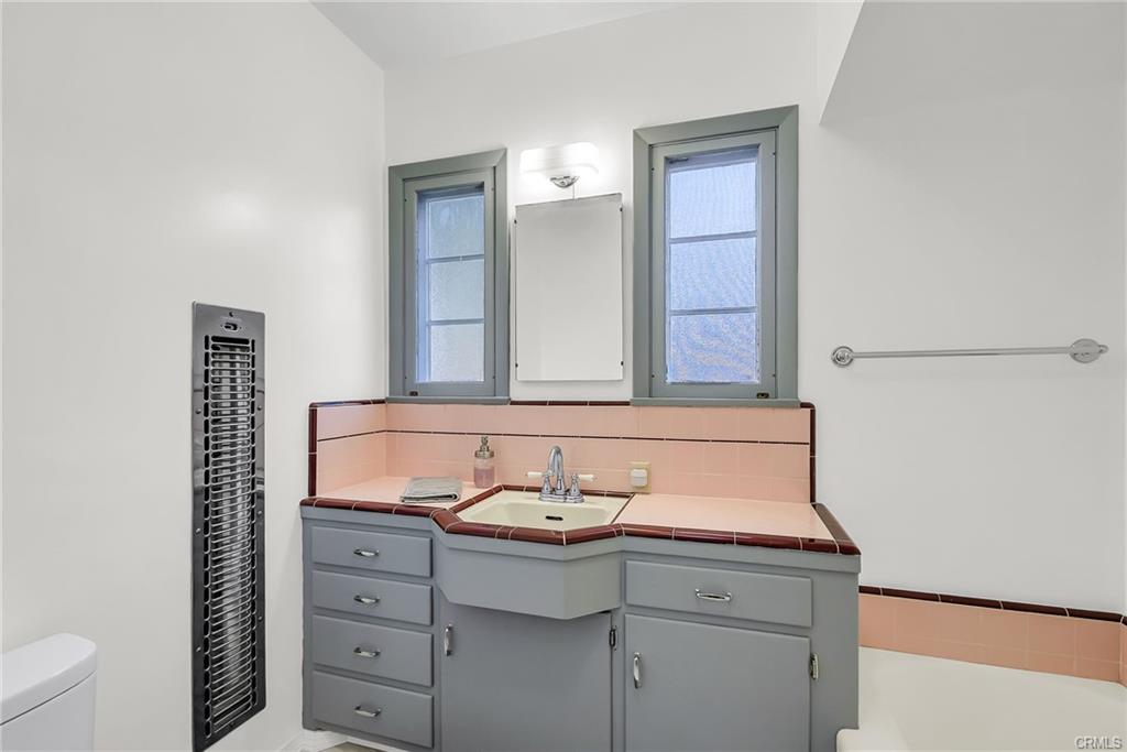Vintage hallway bathroom with wall heater for those nippy mornings.