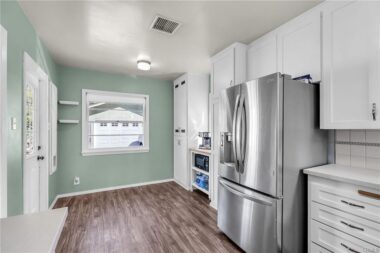 Alternate view of remodeled kitchen with breakfast nook and coffee station.