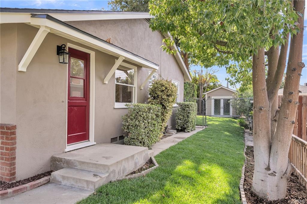 Right side of house which could potentially be utilized as RV parking if needed.