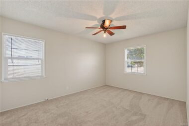 Bedroom number 2, with ceiling fan, and brand new carpet and brand new paint