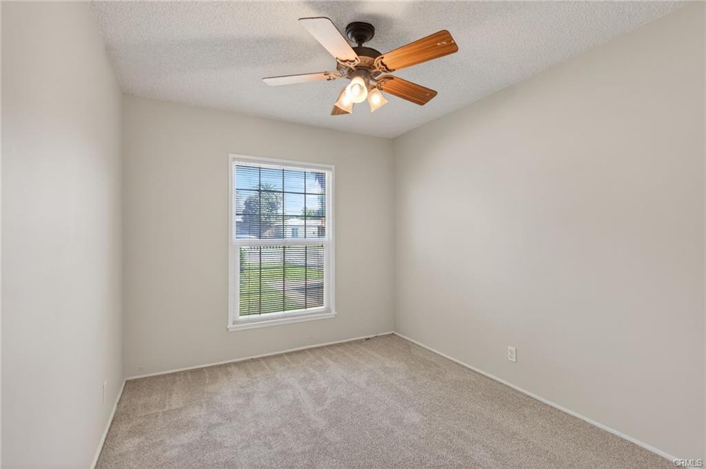Bedroom number 3, with ceiling fan, and brand new carpet and brand new paint.