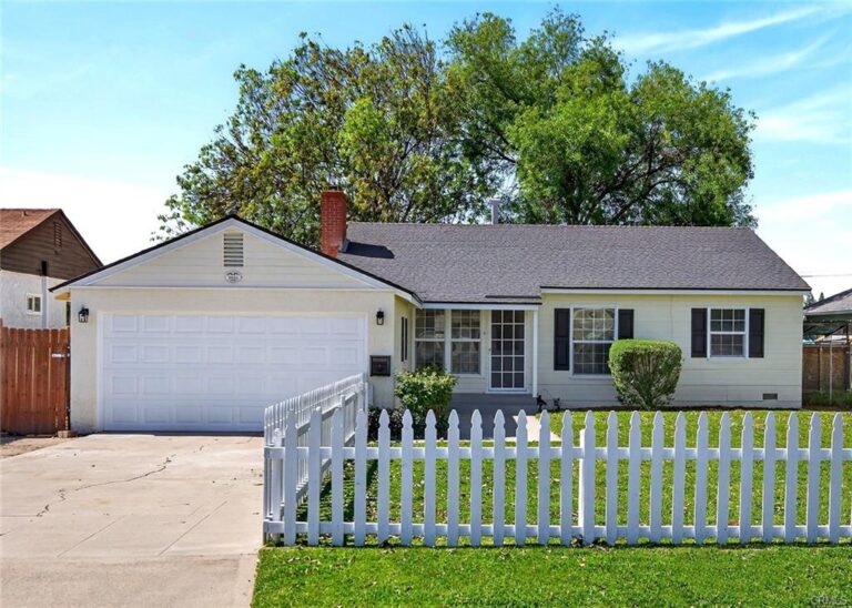 Large fenced front yard surround by newly painted white picket fence, new black shutters, and a turnkey home awaits inside!