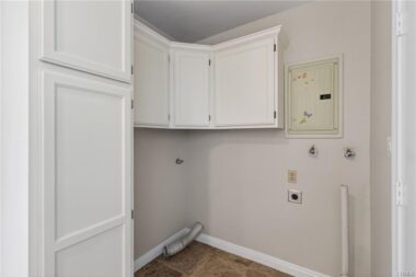 Indoor laundry room adjacent to the kitchen.