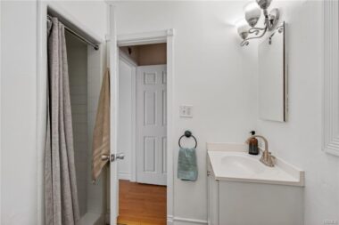 Three-quarter bathroom with shower.
