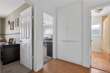 From the hallway, you can get a peek into two of the bedrooms and the hallway bathroom.