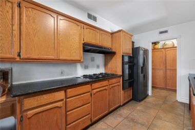 Solid counter tops, gas cook top, and large pantry. And refrigerator stays.