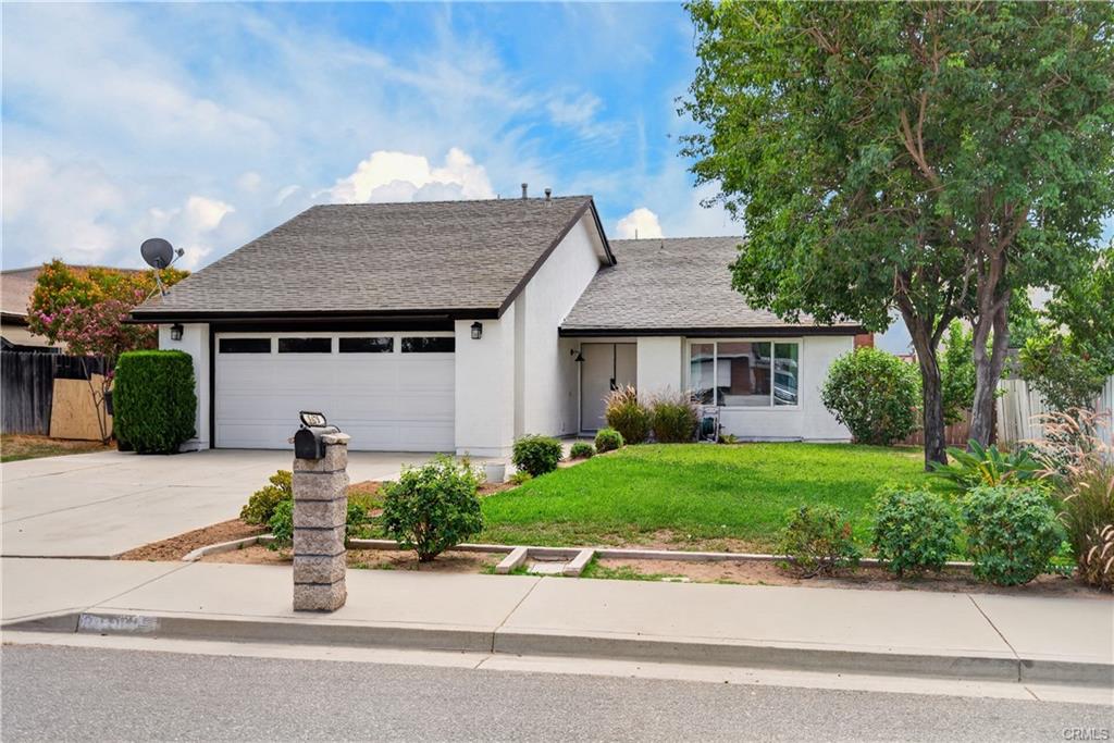 Mature shade tree front yard, 2-car attached garage, and level driveway.