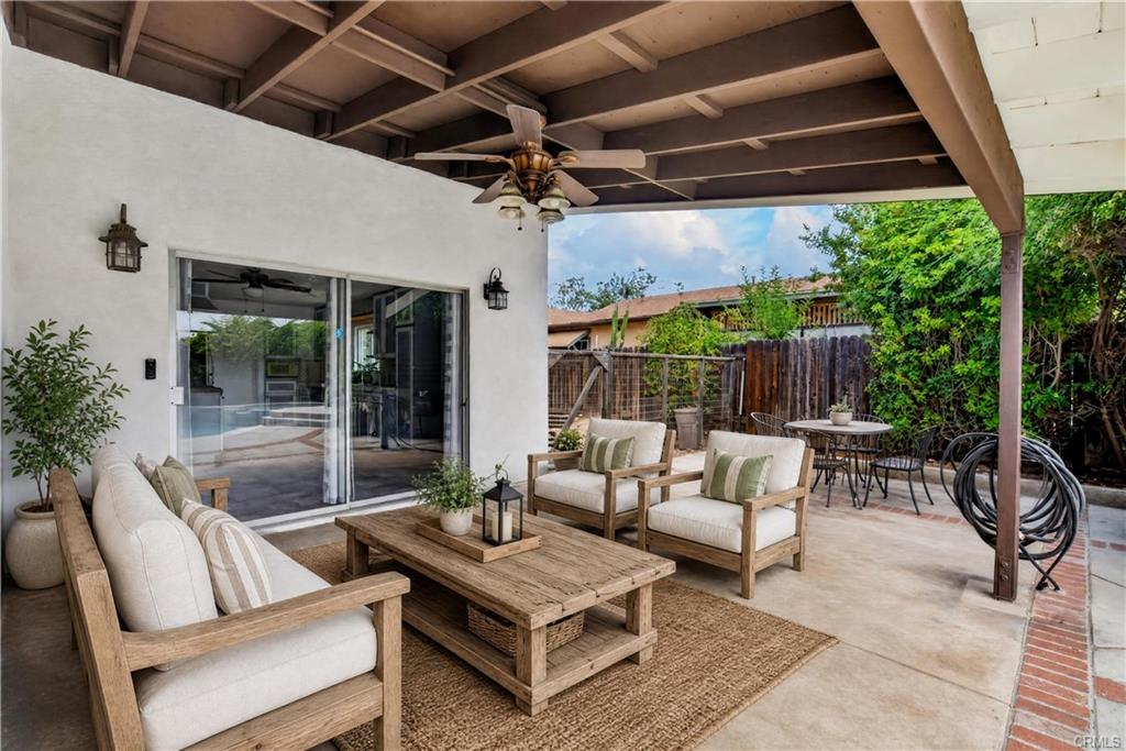 Permitted covered patio with ceiling fan - virtually staged
