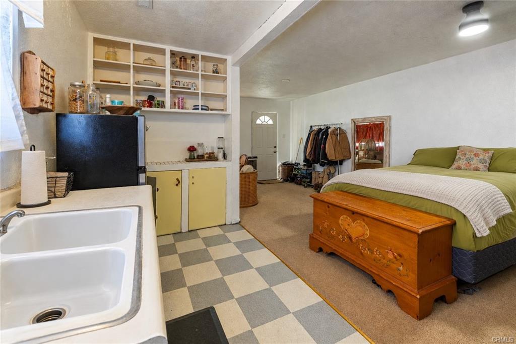 UNPERMITTED ADDITION TO MAIN HOUSE: Studio with small living room and kitchenette and bathroom - approximately 480 sq ft total.