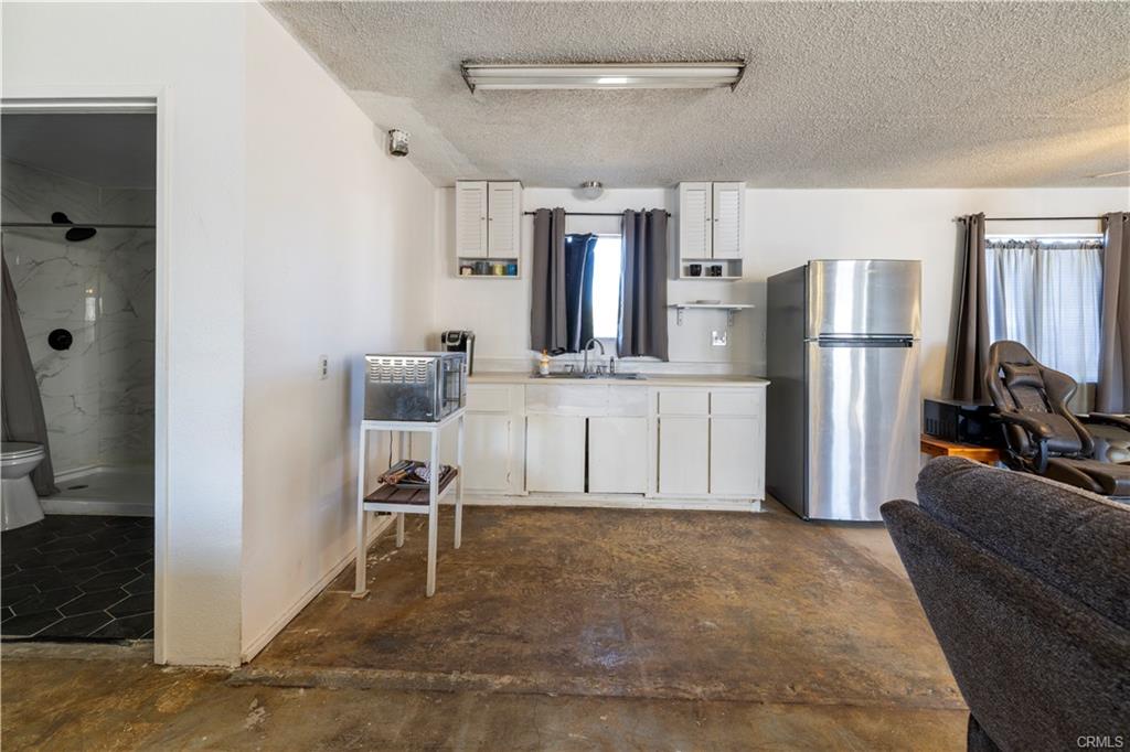 PERMITTED ADU: View into the kitchenette and a partial view of the bathroom.