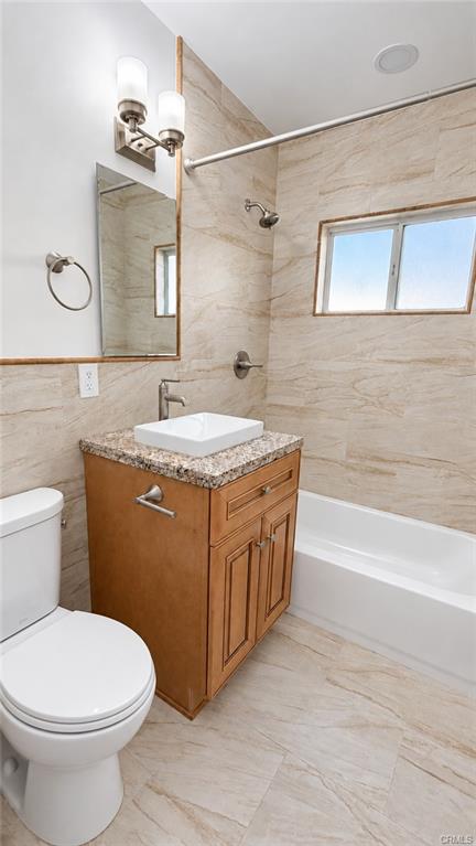 Remodeled full bathroom with granite counter top