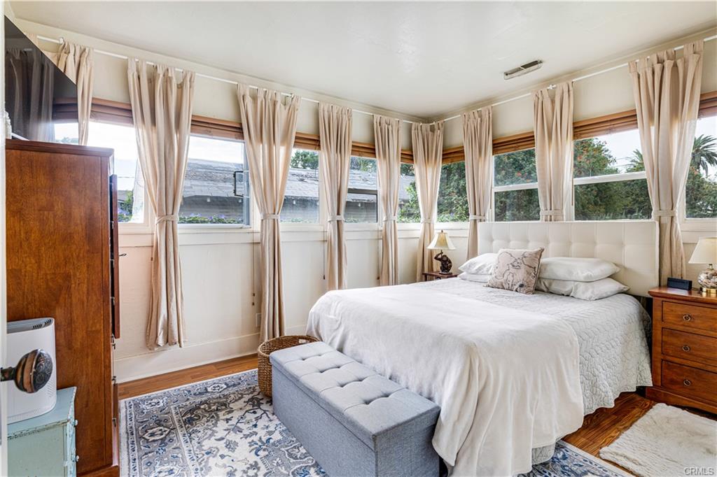 Bedroom #1 with original hardwood floors.