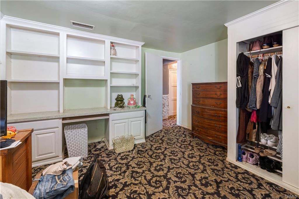 MAIN HOUSE: Bedroom #2 with built-in shelving