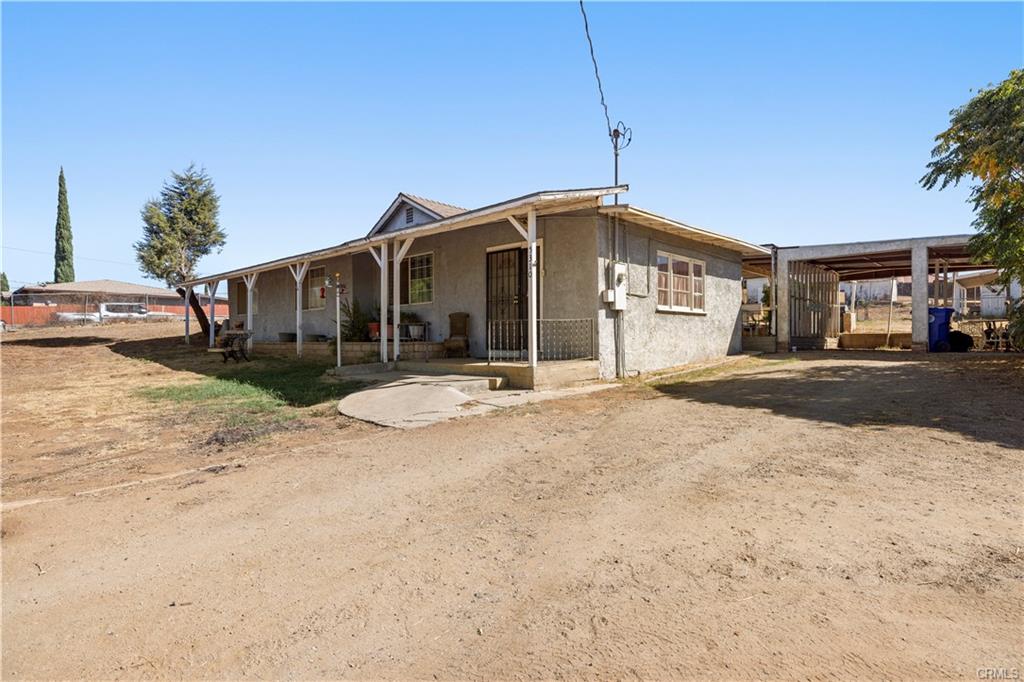 Side angle of front house with carport to the right