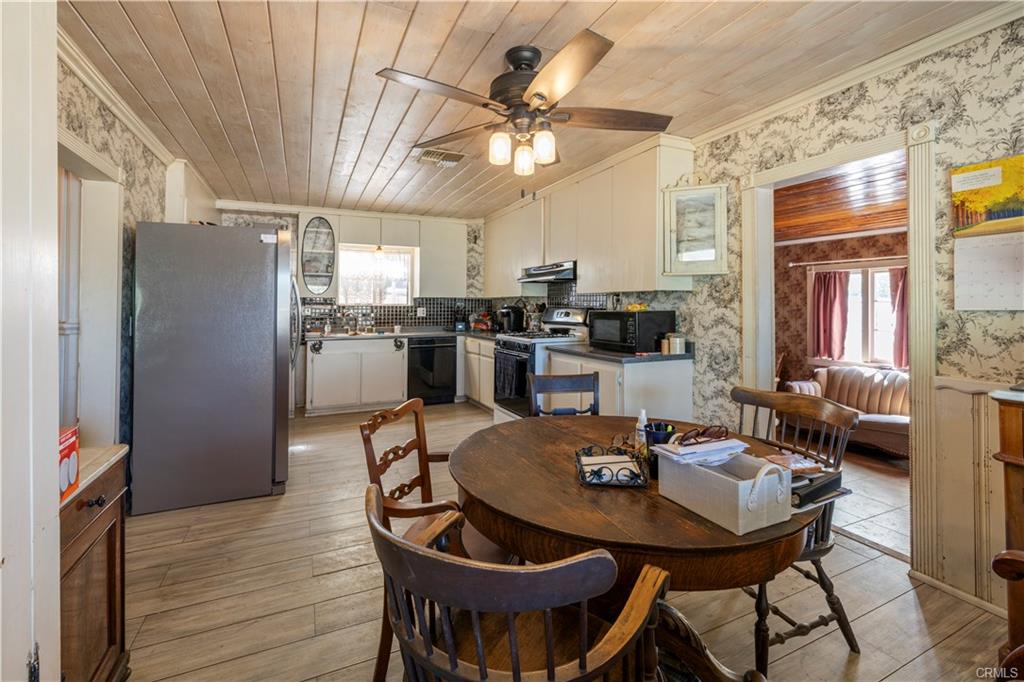 MAIN HOUSE: Dining room with space for a hutch or two in the kitchen.