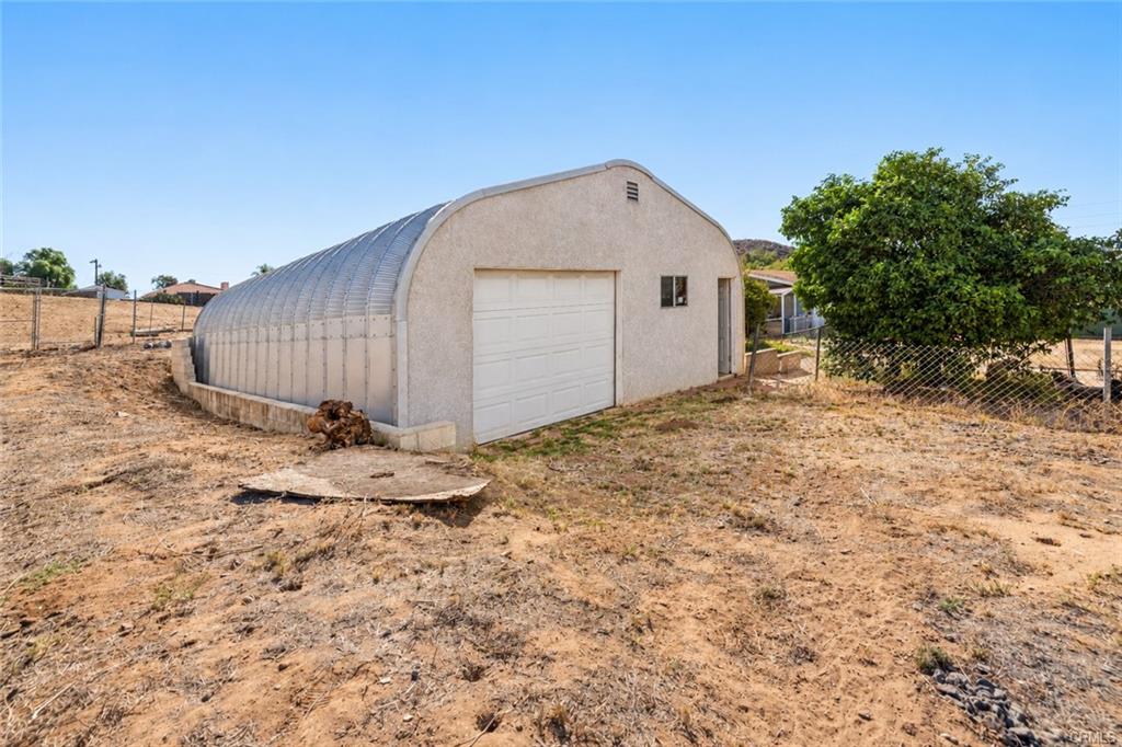 WORKSHOP is approximately 875 sq ft (35' x 25') with a roll up door so you can drive inside.